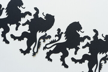 black paper heraldic lion glyphs or dingbats on a white background