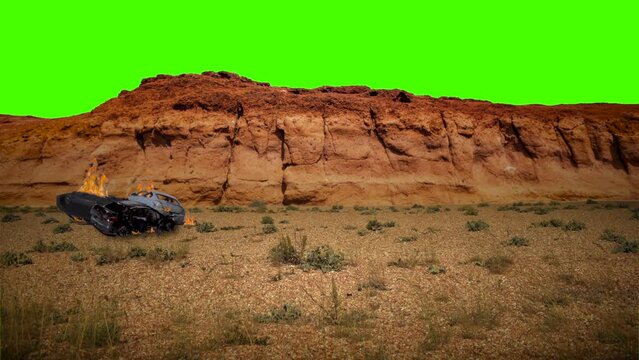 Three wrecked cars burning in the desert green screen