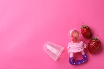 Nibbler with fresh strawberries on pink background, flat lay. Space for text