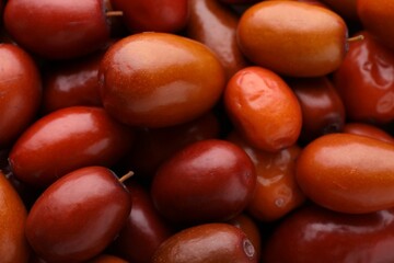 Heap of ripe red dates as background, closeup