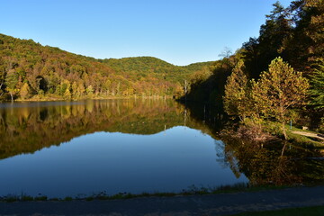 Fototapeta na wymiar reflection of mountains in small lake