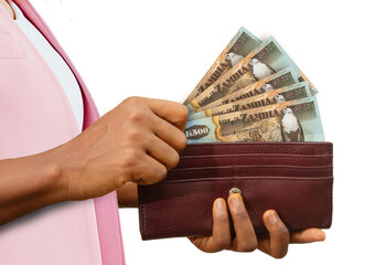 fair Female Hand Holding brown Purse With Zambian kwacha notes, hand removing money out of purse...