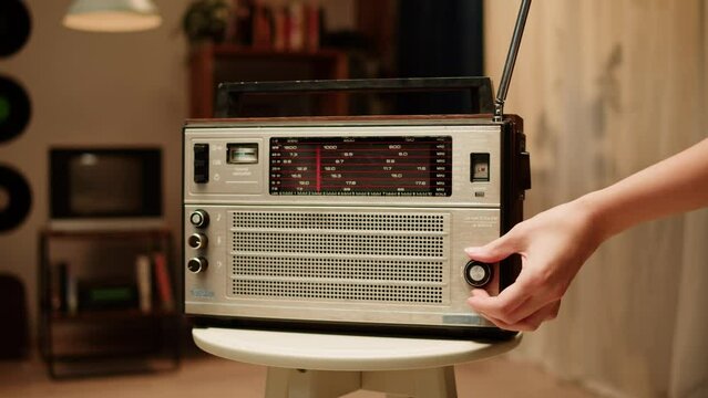 Retro radio tape recorder close-up. Listening to music, old radio boombox player, searching channel. 