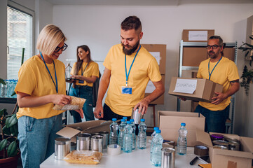 Group of volunteers working in community charity donation center