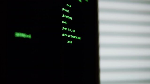 Retro pc with loading code console, programmer making scripts, green basic screen, Old computer studio close-up, Desktop vintage retro wave display, late 90s PC.