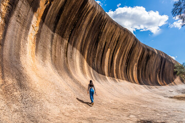 A teenager girl at Wave rock in Hyden, West Australia