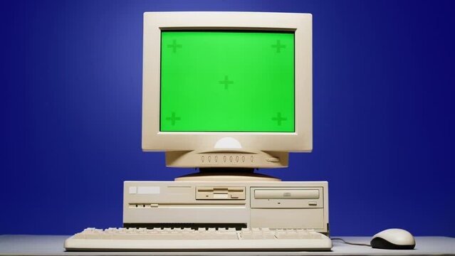 Retro pc with chroma key green screen, Old computer studio close-up, Desktop vintage retro wave display, late 90s PC mock up for 3d motion design and advertising. 