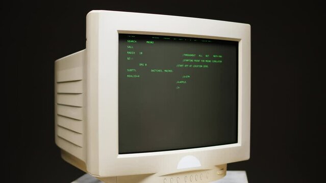 Retro pc with loading code console, programmer making scripts, green basic screen, Old computer studio close-up, Desktop vintage retro wave display, late 90s PC.