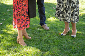 friends or family outdoors at garden formal gathering or celebration