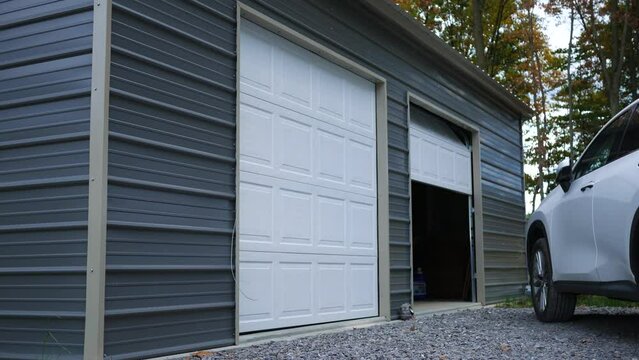 A two stall garage with one door partially open
