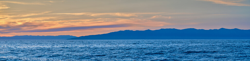 Sunset on Lake Baikal in the Barguzin Bay. Republic of Buryatia, Maksimikha settlement.