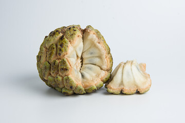 sugar apple ( srikaya ) with black spots, isolated on a white background, sugar apple fruit tastes sweet, grows in the tropics. can be eaten directly when it is ripe or can be processed first.