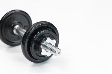 Obraz na płótnie Canvas steel dumbbell on white background, close up, copy space, fitness, weight training 