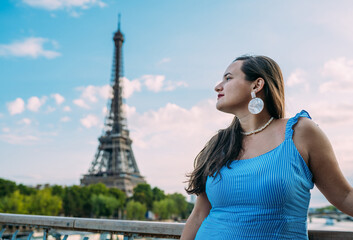 Holidays in Paris. Young girl enjoying Paris, France. Summer vacation in Europe. Eiffel Tower.