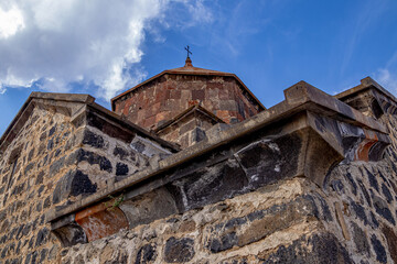 An ancient stone monastery against the blue sky