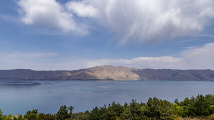 Big mountain lake Sevan in Armenia under a blue sky with clouds