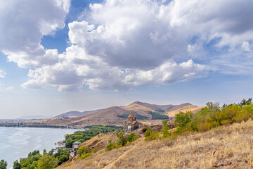 Big mountain lake Sevan in Armenia under a blue sky with clouds