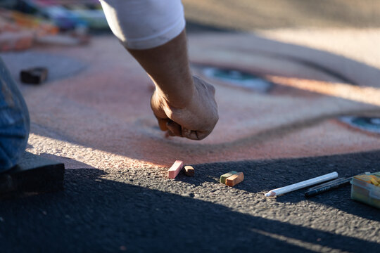 Artist Drawing At A Chalk Art Festival