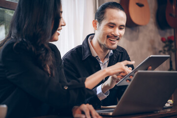 Two businessperson enjoyed meeting on the project. two partner discussing business planning with technology.