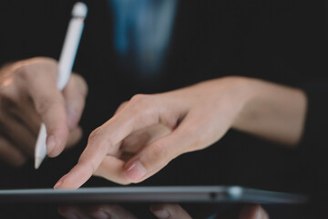 The Communication technology on laptop computer and tablet. Business man working and meeting using internet connection at office. Young adult is modern in job by digital system.