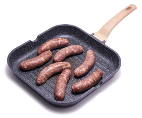 Raw beef or pork grill sausage on grill frying pan isolated on white background
