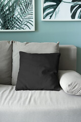 Beautiful black pillow mockup couch with modern interior background