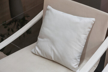 Fototapeta na wymiar Beautiful white pillow mockup couch with modern interior background
