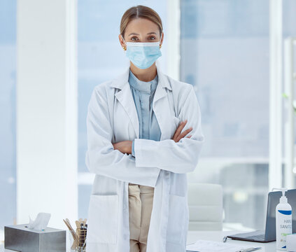 Covid, Face Mask And Woman Doctor With Trust, Insurance Help And Protection To Stop Spread Of Global Virus In Hospital. Portrait, Medical Worker And Healthcare Employee In Covid 19 Safety Compliance