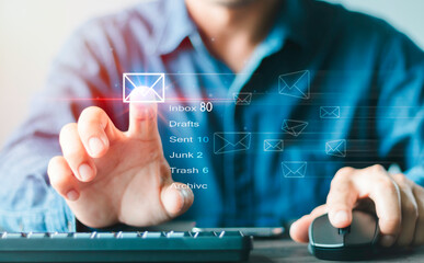 Businessman hand using Computer with email icon, Email typing on keyboard and surfing the internet, email marketing concept, sending e-mail or newsletters, online working internet network.