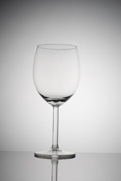 empty wine glass on a white background with vignetting