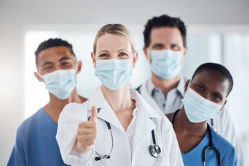 Thumbs up, covid and doctors with nurses with mask at hospital or clinic. Portrait, health goal or...