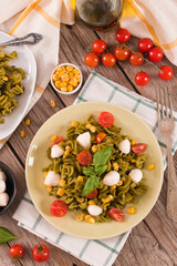 Fusilli pasta with cherry tomatoes and sweet corn.