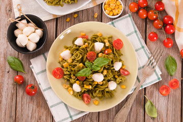 Fusilli pasta with cherry tomatoes and sweet corn.