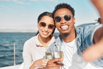 Yacht, luxury and sea travel couple with champagne smiling on their anniversary in summer. Happy, love smile and ocean selfie of a woman and man on holiday with happiness drinking alcohol together