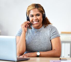 Portrait of a call center, customer service and telemarketing agent with a headset while consulting...