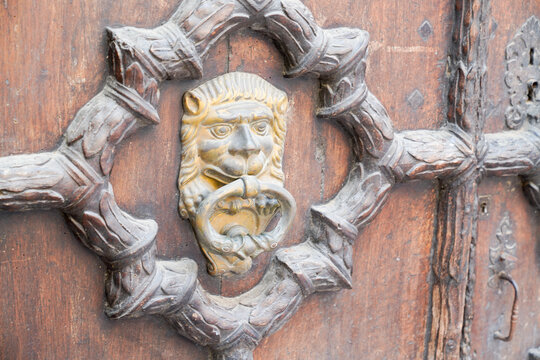 vintage lion knock old steel door knocker on wooden door