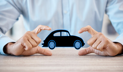 Man with model car in hands, promote business of insurance or vehicle finance at table in office. Businessman show toy auto, to advertise sale or motor repair workshop on desk at work or home