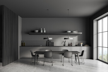 Front view on dark kitchen room interior with panoramic window