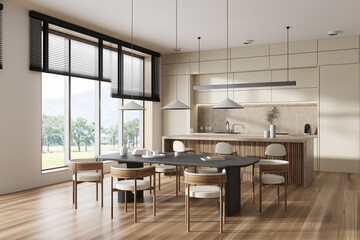 Stylish kitchen interior with dining and cooking area, panoramic window