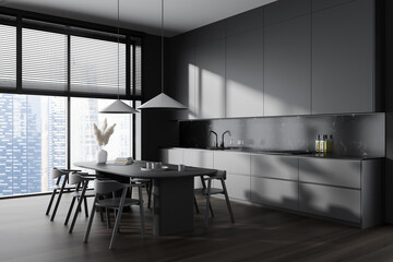 Grey kitchen interior with dining table and chairs, panoramic window