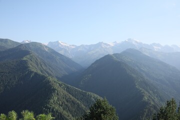 Fototapeta premium Aerial view of beautiful landscape with mountain forest on sunny day