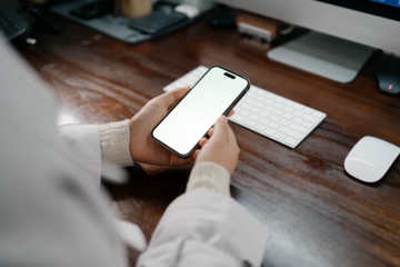 woman using smartphone in office