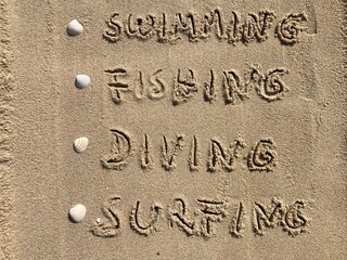 In the sand are listed vacation activities