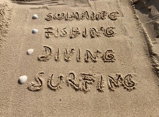 In the sand are listed vacation activities