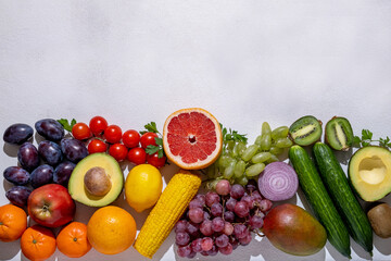 
Healthy food, fruits and vegetables on white wooden board, copy space
