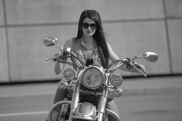Portrait of young woman with motorcycle