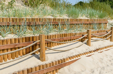 Fence near walking path for reinforcement of dunes