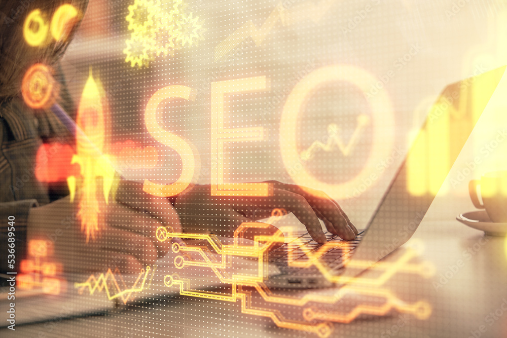 Poster double exposure of woman hands working on computer and seo hologram drawing. internet search concept