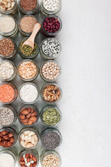Vegan protein source. assortment of healthy vegetarian food. top view of seeds, nuts, peas, beans, rice, spelt, oatmeal on white background