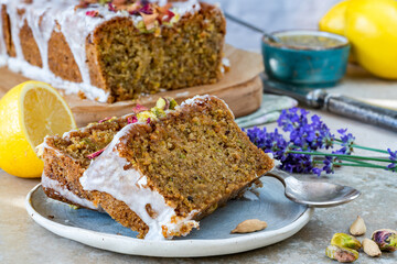 Pistachio, cardamom and lemon drizzle cake